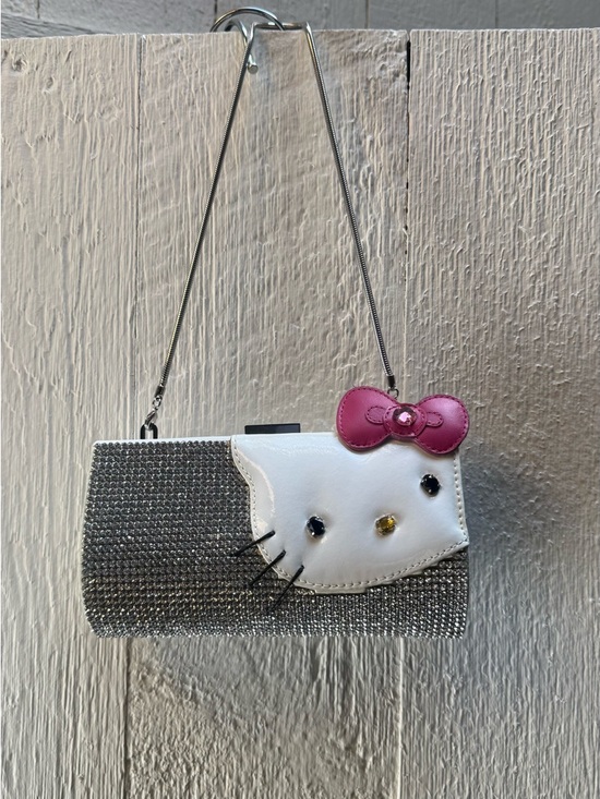 Swarovski Handbags - Swarovski Silver Crystal Hello Kitty Clutch with Pink Bow